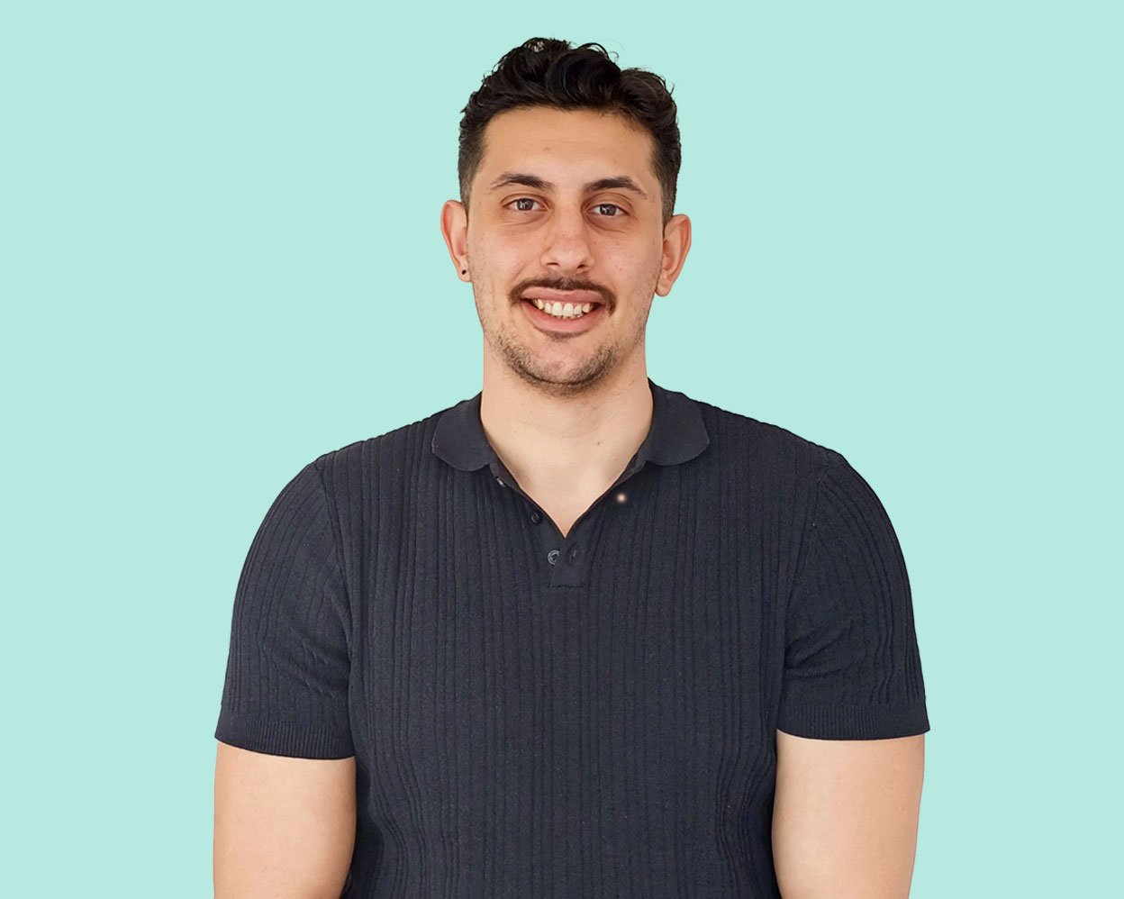 A man smiles at the camera