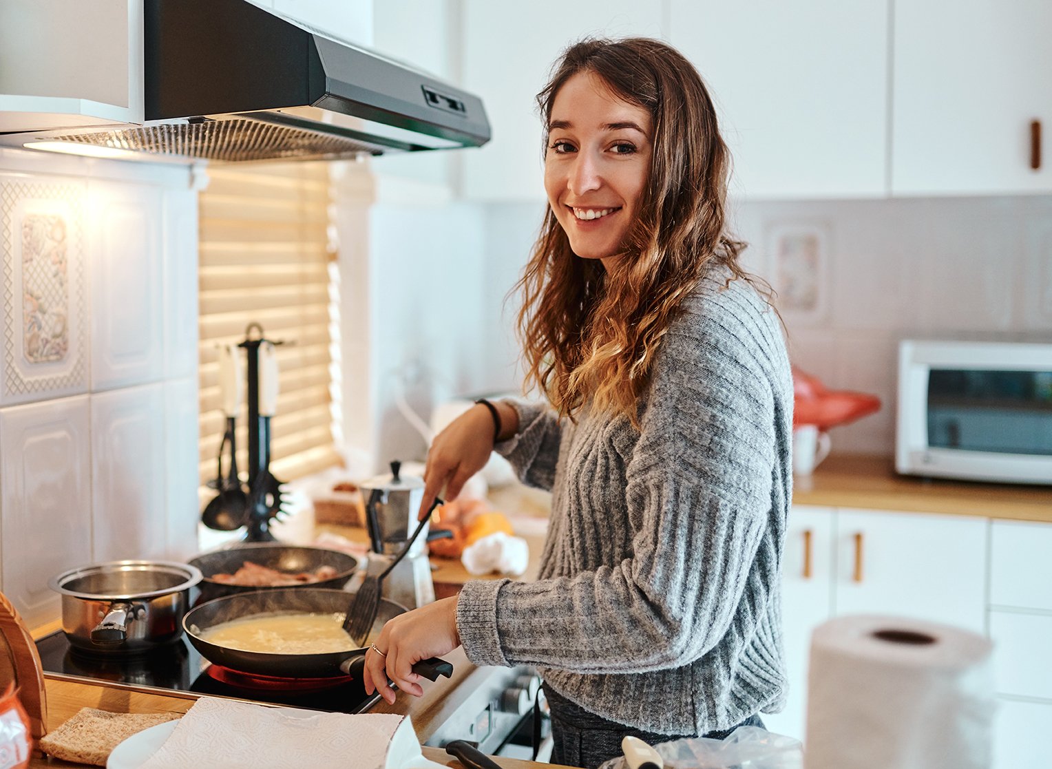A young women cooking.