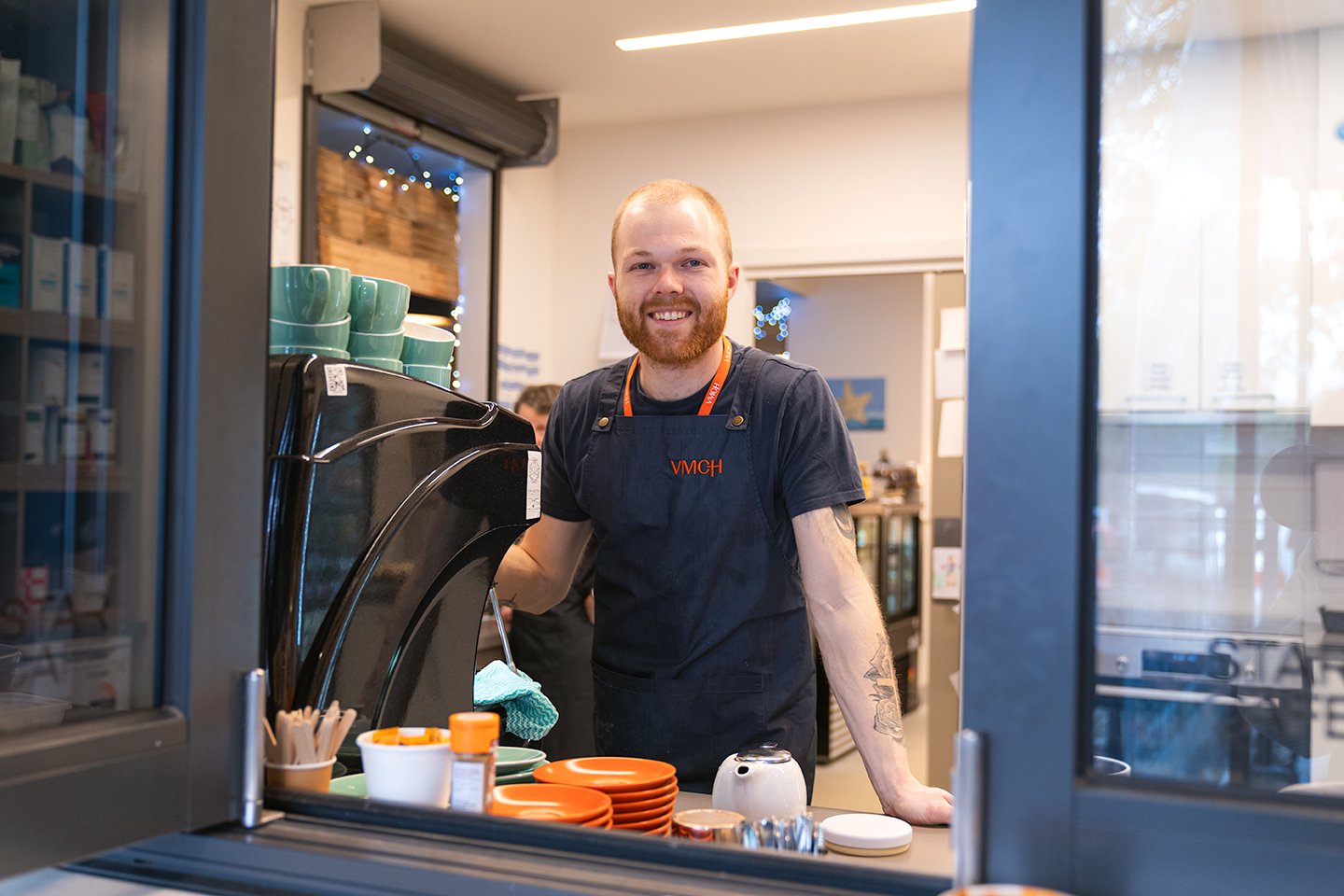 a man stands in a cafe