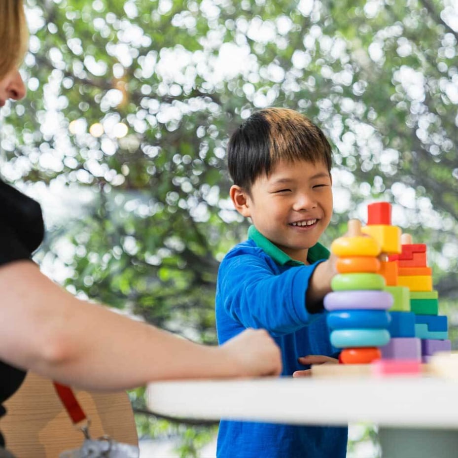 A child builds with blocks